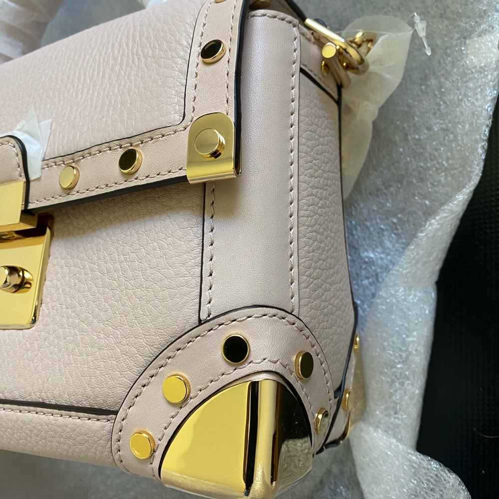 Michael Kors, Brand new, soft pink, golden hardware. 8.25/6/3.5 inch.